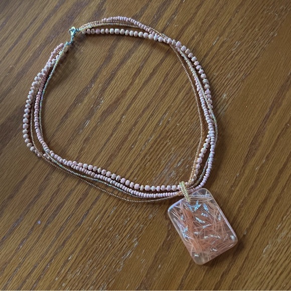 Necklace cute four bead strands 21” with plastic 2” pendant in soft peach color. - Picture 2 of 7